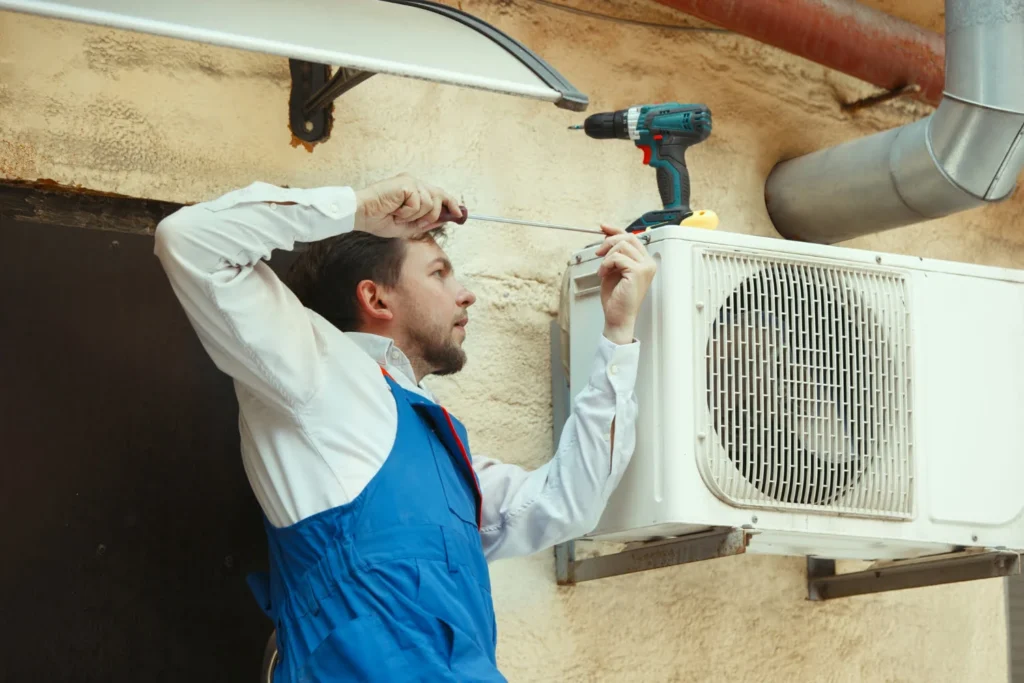a man doing air conditioning repair