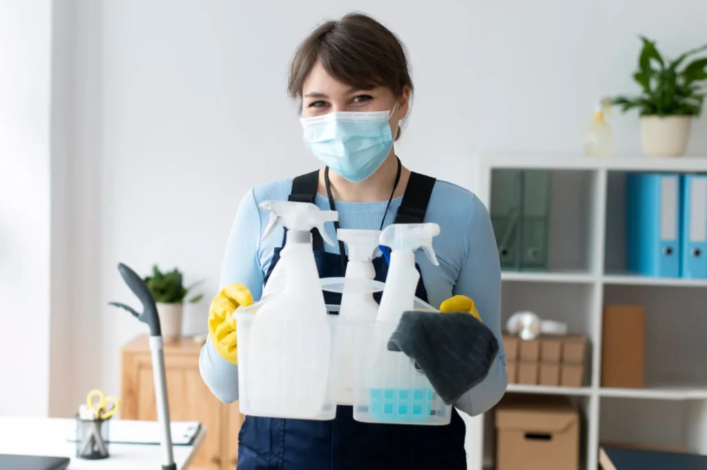 cleaning service women carrying cleaning materials
